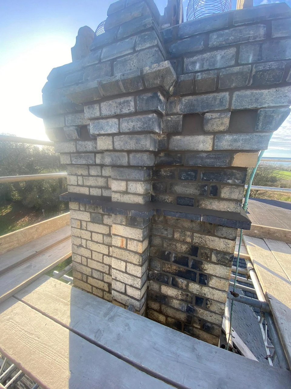 Rebuilt chimney stack in matching brickwork