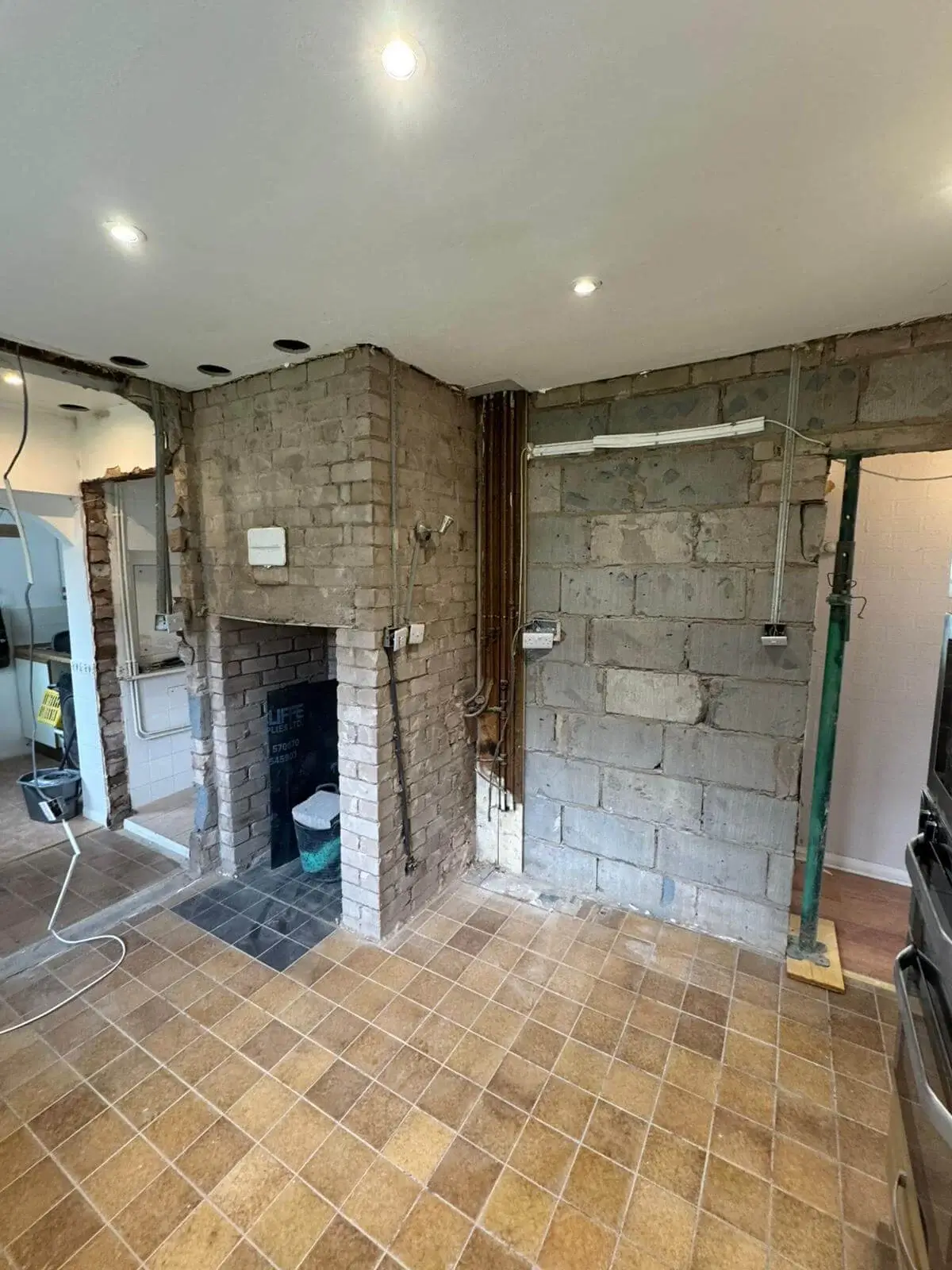 Brickwork and structural wall preparation for an open-plan conversion in Flintshire.