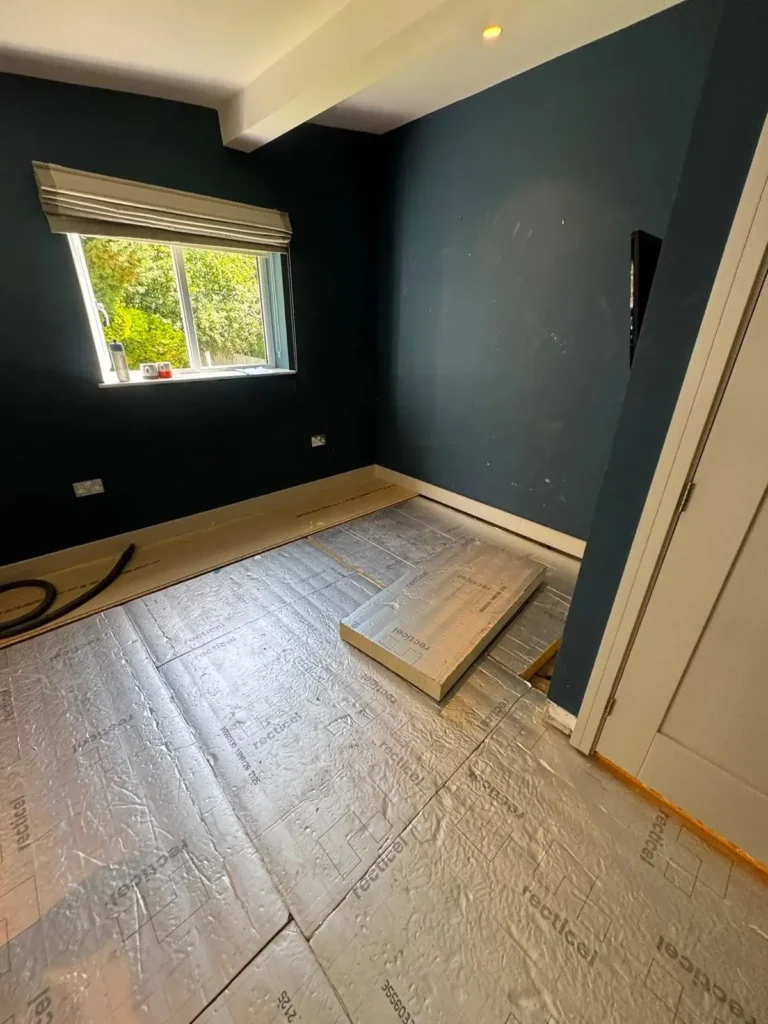 Emergency builder during flood repair in Flintshire