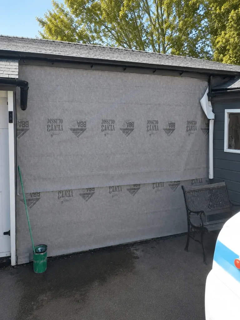 Emergency builder installing temporary weatherproof protection to a property in Wirral (2)