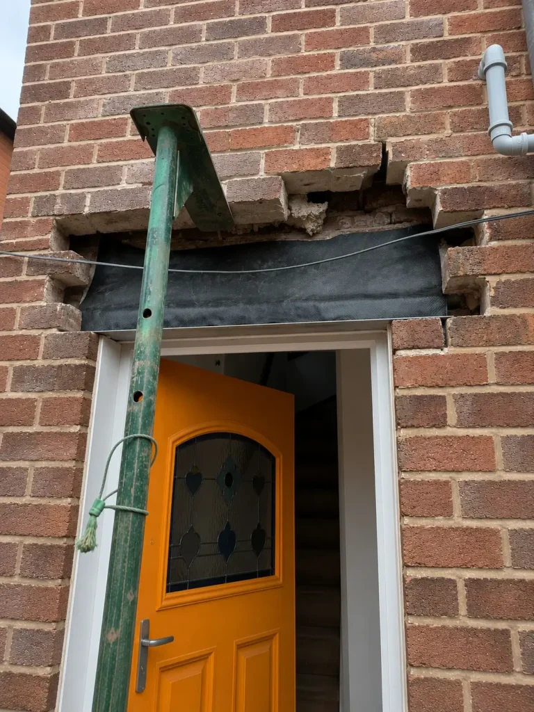 Emergency structural repairs to damaged brickwork above a front door in Chester