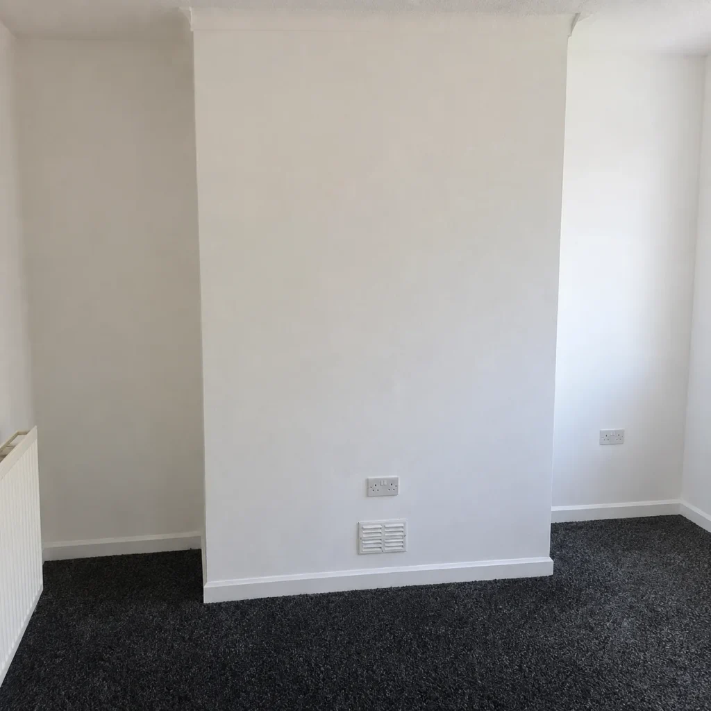 Damp staining to a chimney breast wall recorded during a damp survey in Flintshire