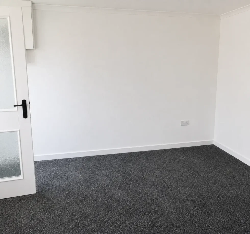 Damp to a living room corner recorded during a damp survey in Flintshire