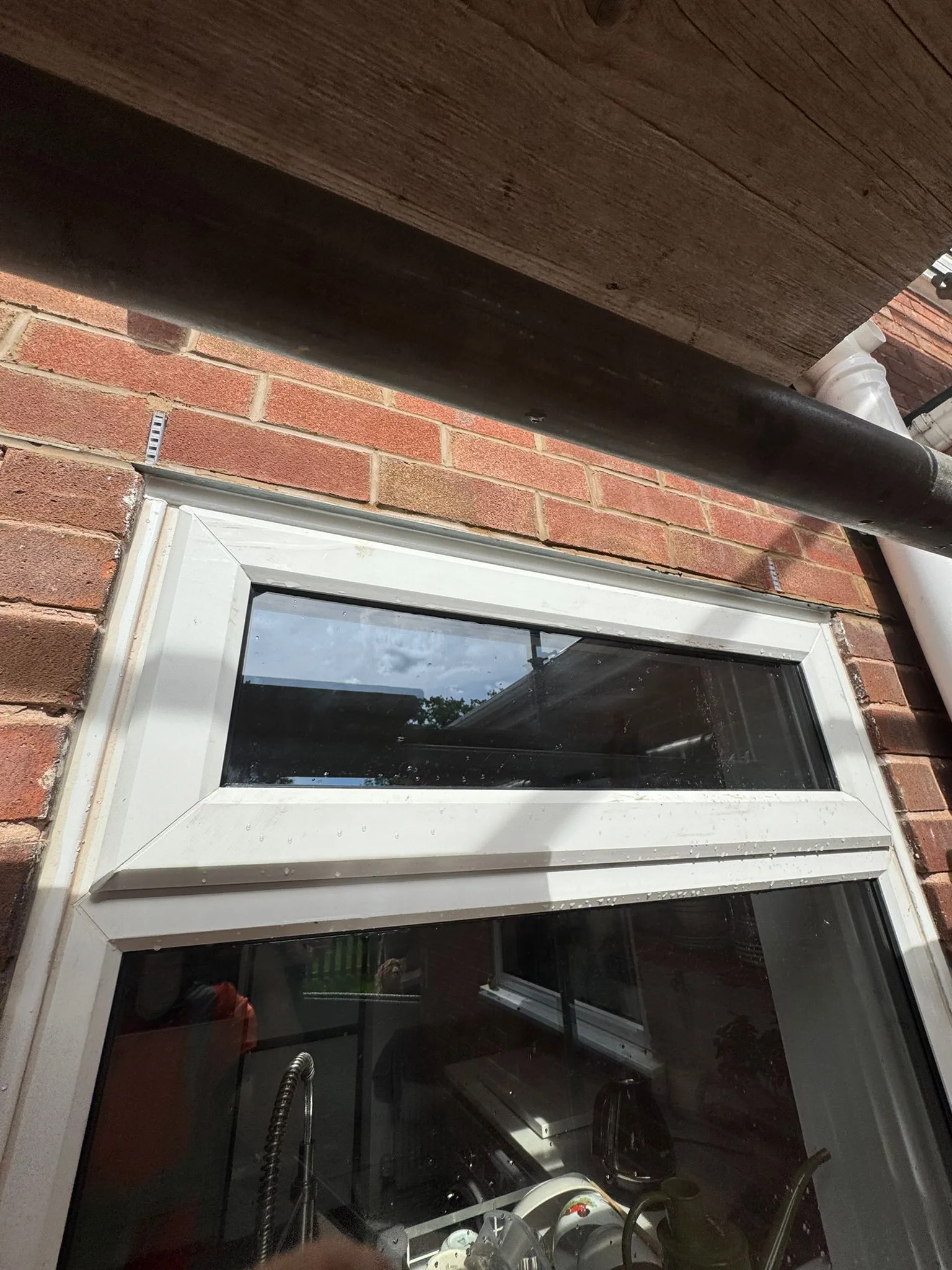 Replacement galvanised steel lintel fitted above a doorway