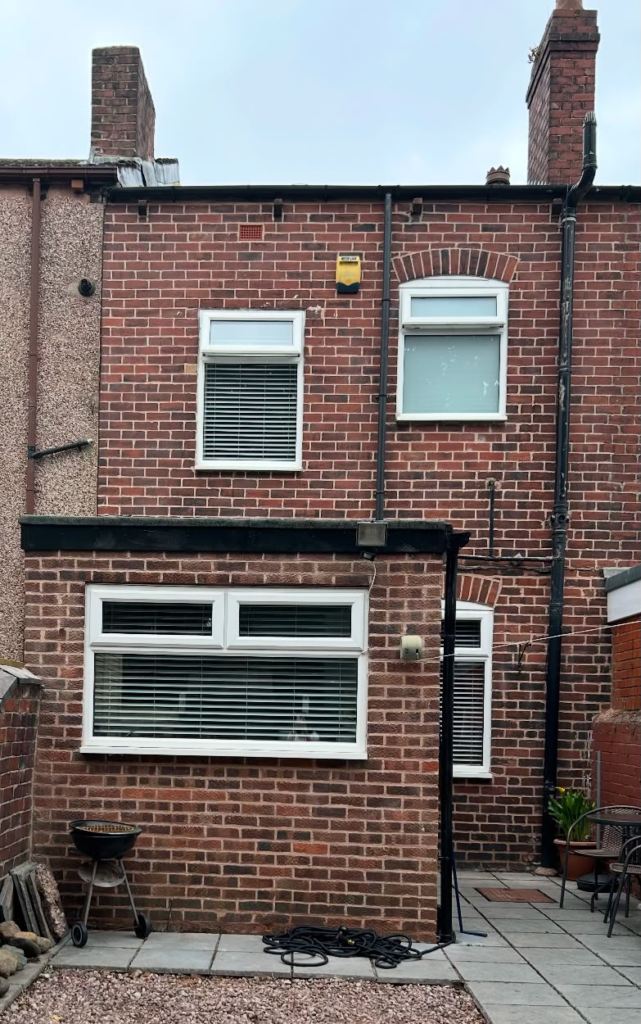 Rear elevation of a terraced house in Hightown, Wrexham after repointing in NHL 3.5 lime mortar