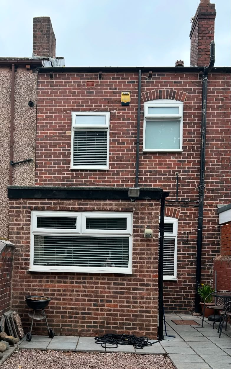 Rear elevation of a terraced house in Hightown, Wrexham after repointing in NHL 3.5 lime mortar