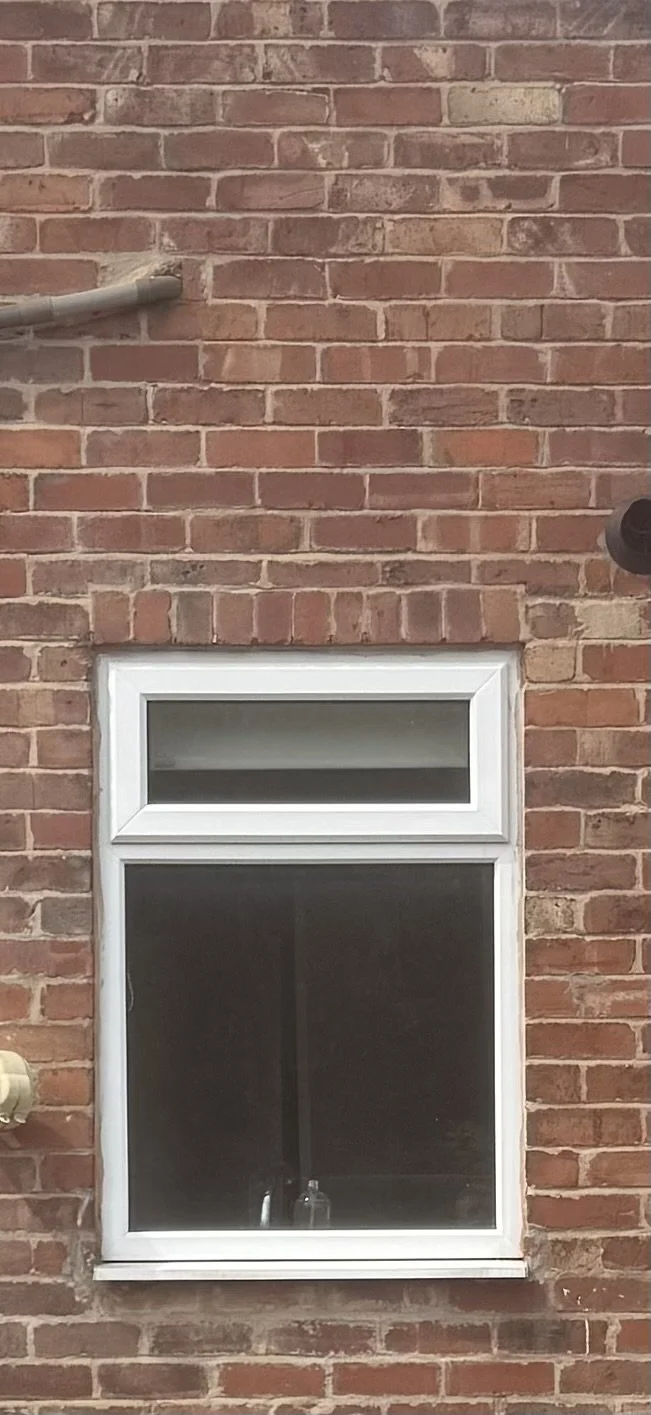Rear ground floor window opening on a terraced house in Deeside, Flintshire, one of two openings priced for a new lintel after the pre-purchase survey