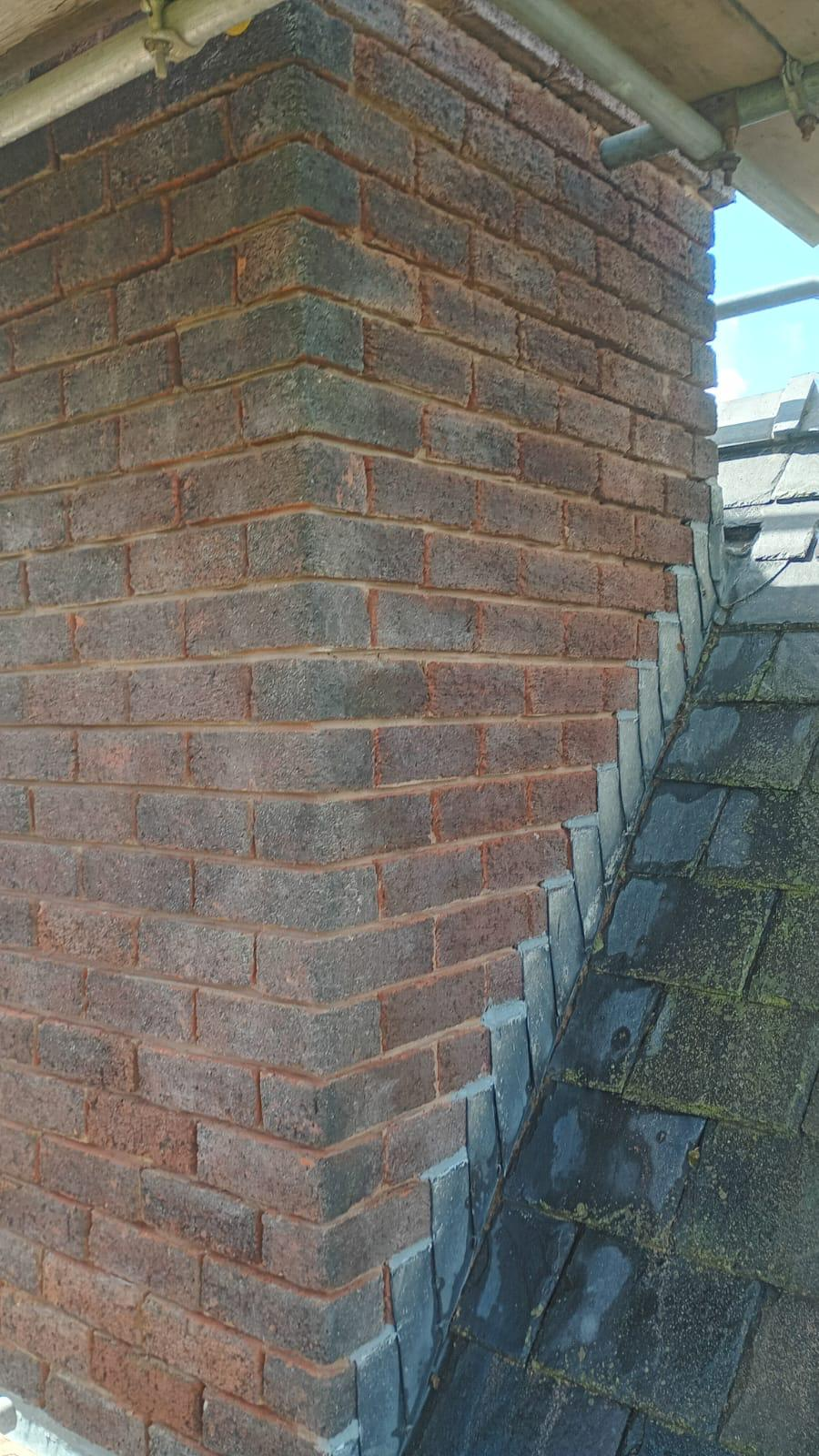 Chimney brickwork joints raked out to a sound depth ready for repointing in Flintshire