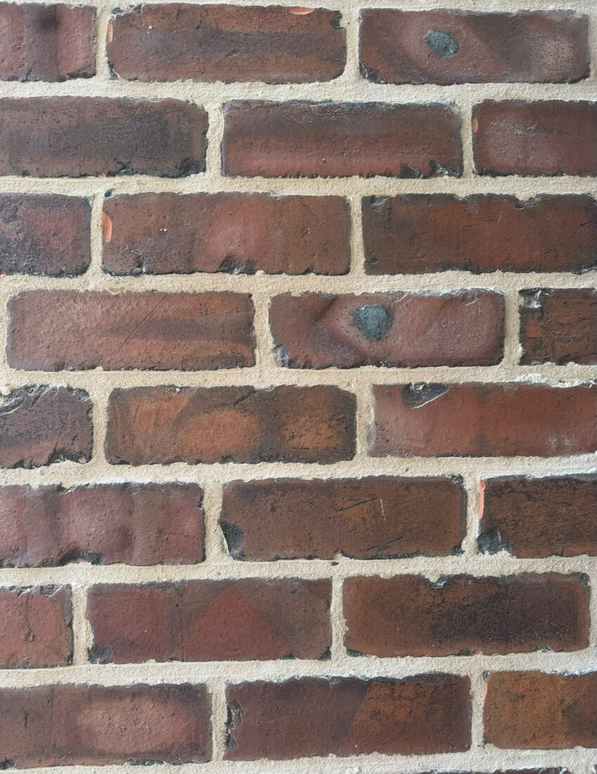 Completed lime mortar joints compacted into raked-out brickwork