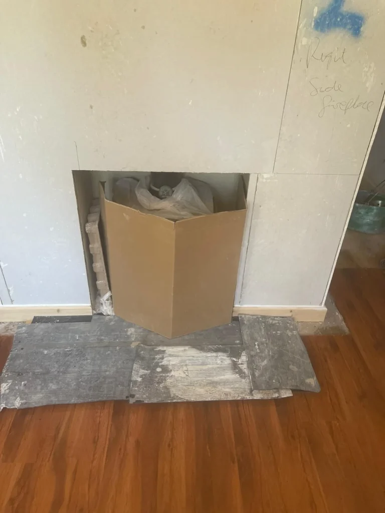 Plasterboard installation following damp treatment to internal wall at property in Hope, Flintshire