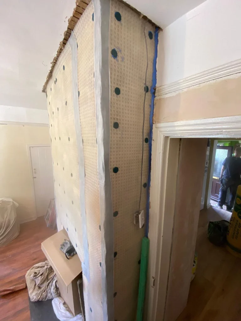 Salt-resistant membrane installed during damp proofing and remedial works following a damp survey in Hope, Flintshire