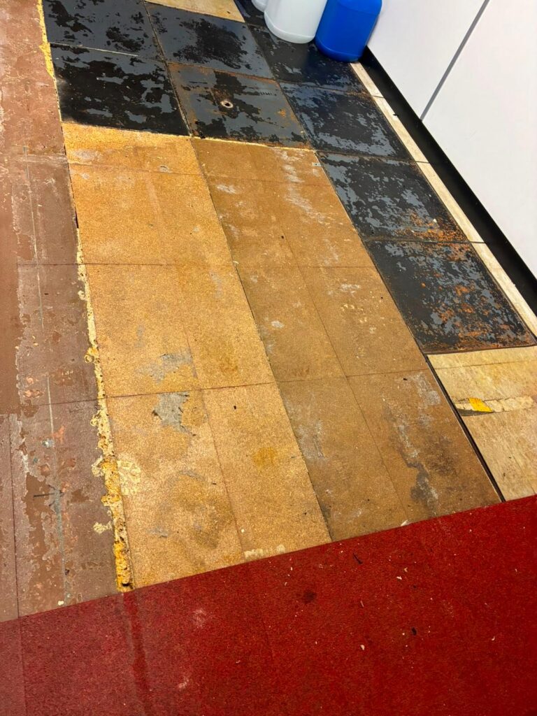Floor covering lifted after a flood to expose the chipboard beneath for moisture testing and drying