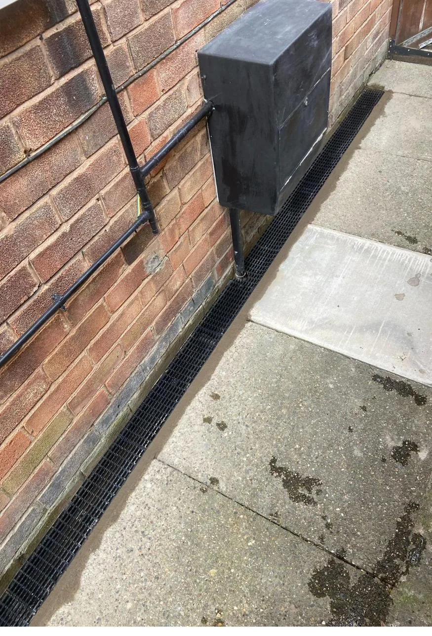 New ACO channel drainage installed along an external wall in Deeside