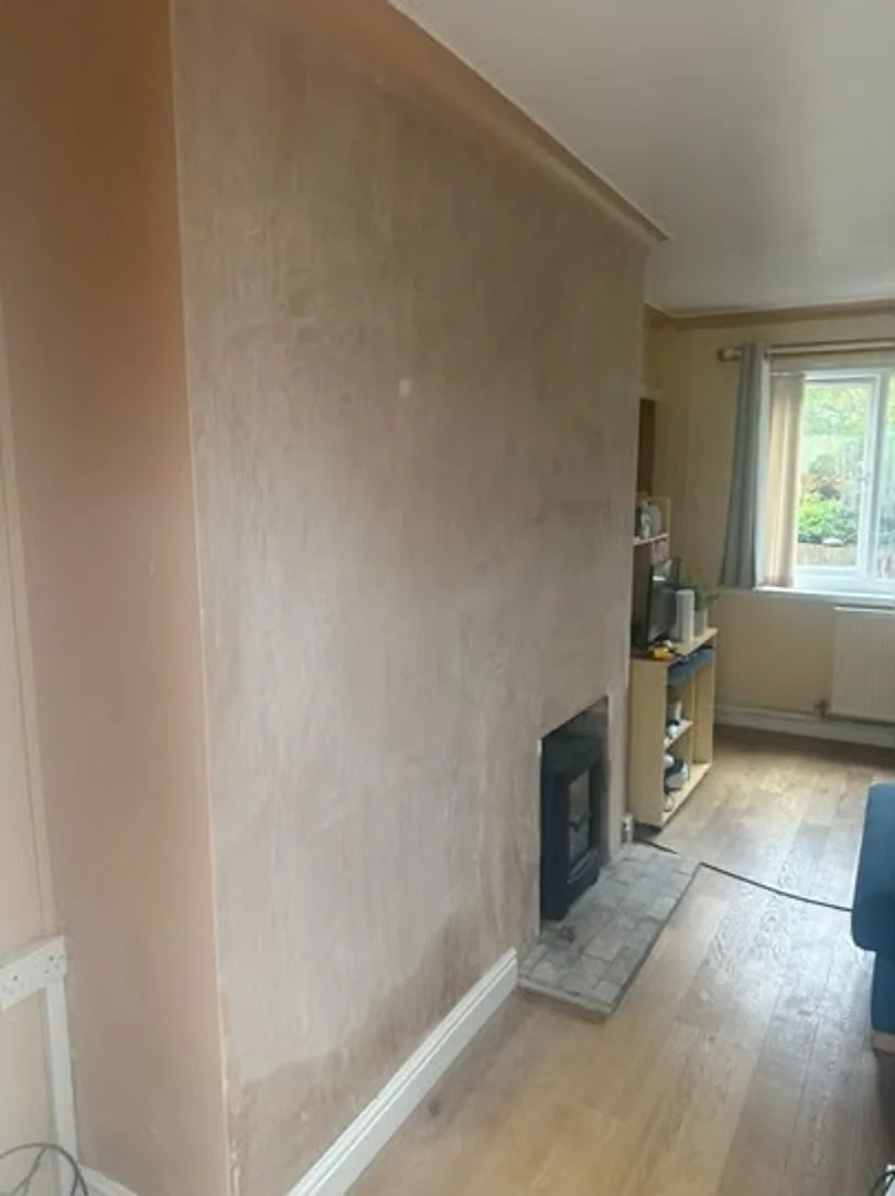 Replastered chimney breast after damp proofing in Heswall, Wirral
