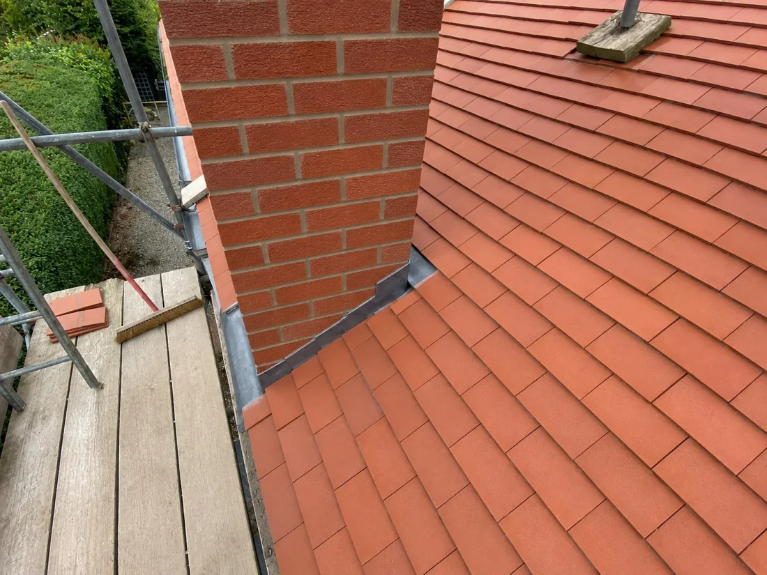Chimney repointed and lead weathering renewed from scaffolding in Flintshire