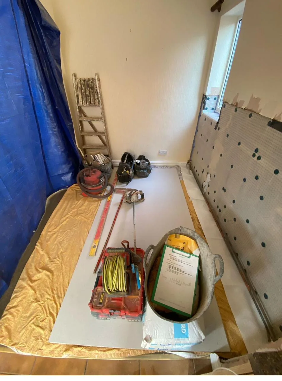 Studded damp proof membrane fixed to walls during damp proofing in Deeside