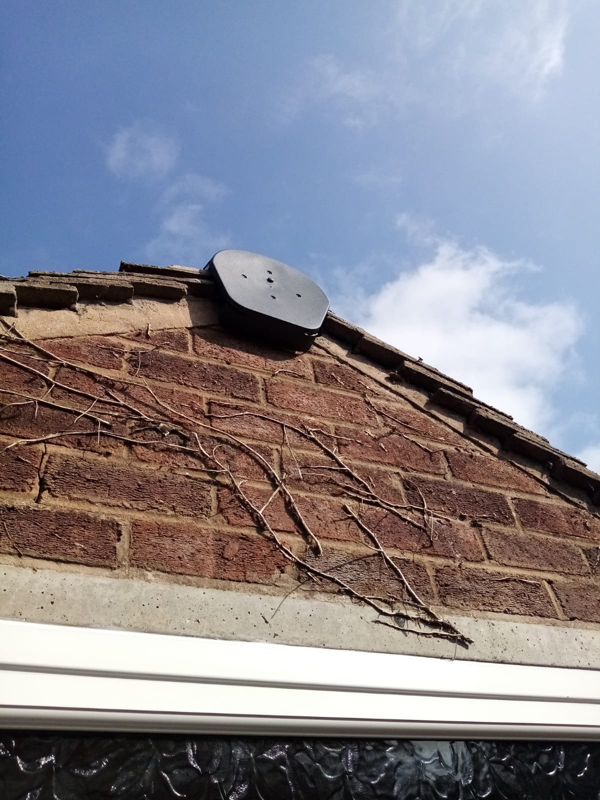 Gable verge of a Handbridge bungalow with the mortar bedding cracked and broken away along its length