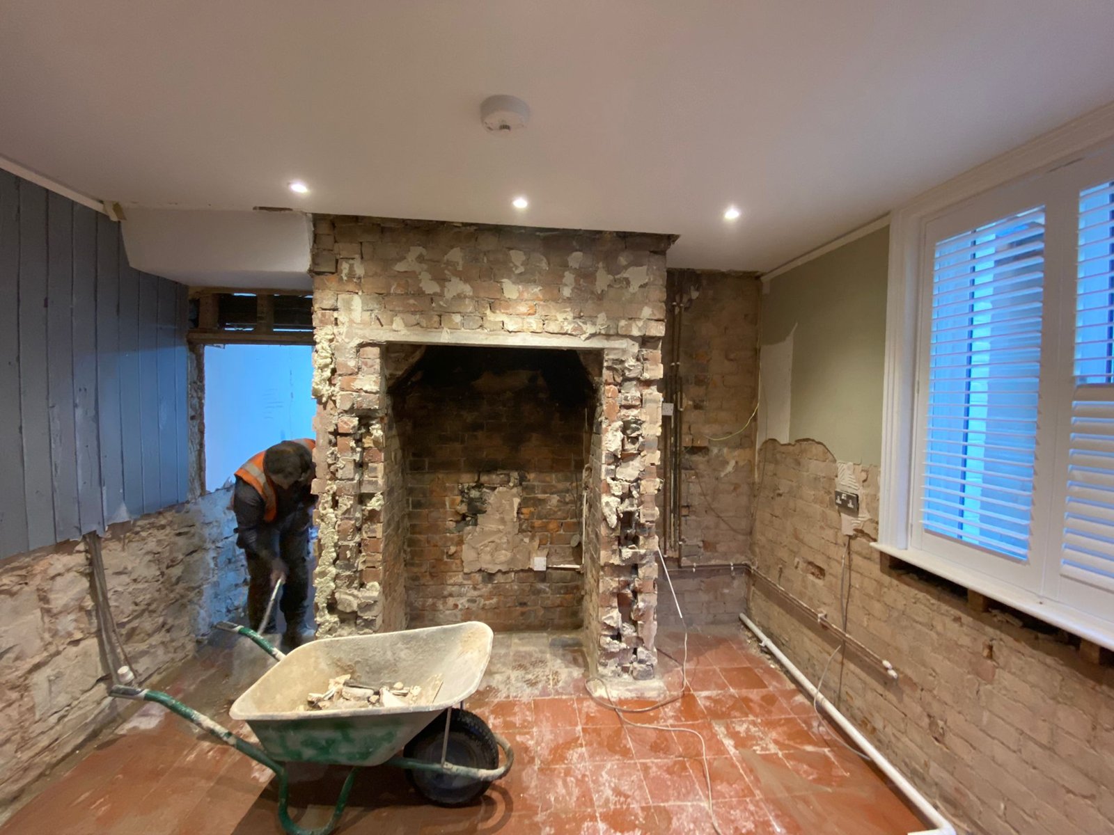 Room in an 1860s Flintshire house with the old quarry tile floor still in place before damp floor treatment