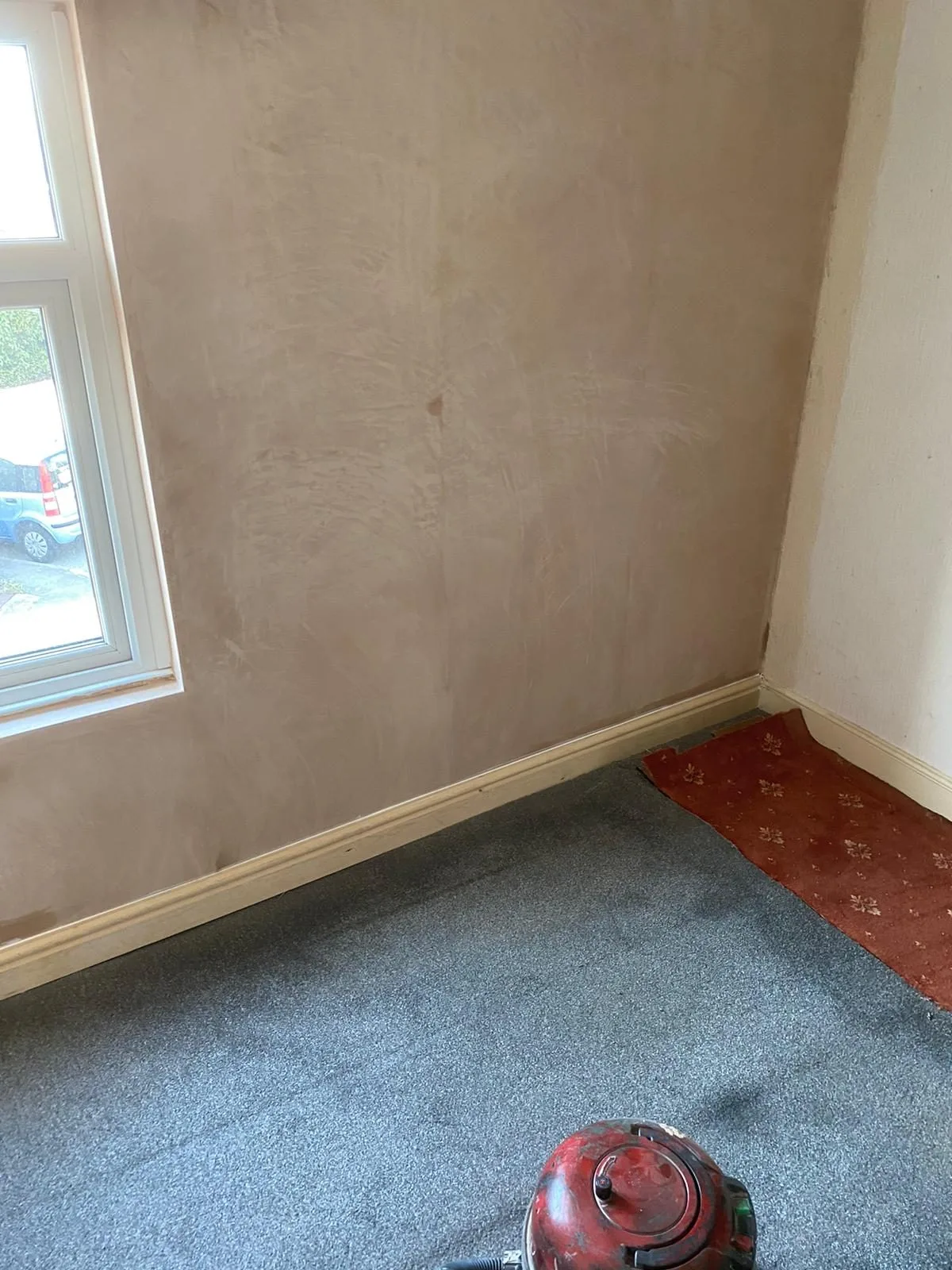 Internal wall replastered and finished with new skirting board following crack stitching repairs