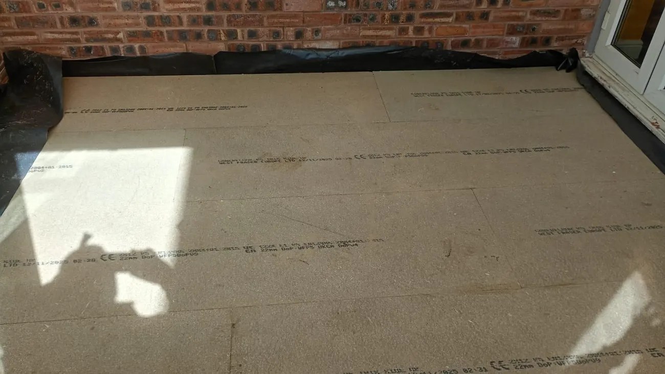 New 22mm moisture-resistant chipboard floor deck laid over insulation in a garden room in Chester