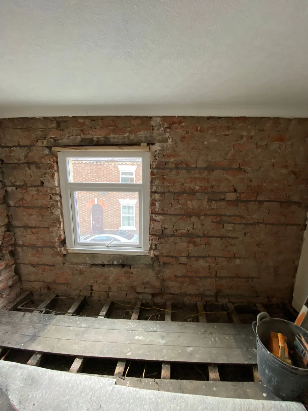 Stainless-steel helical reinforcement bars installed into the mortar joints to stabilise cracked brickwork.