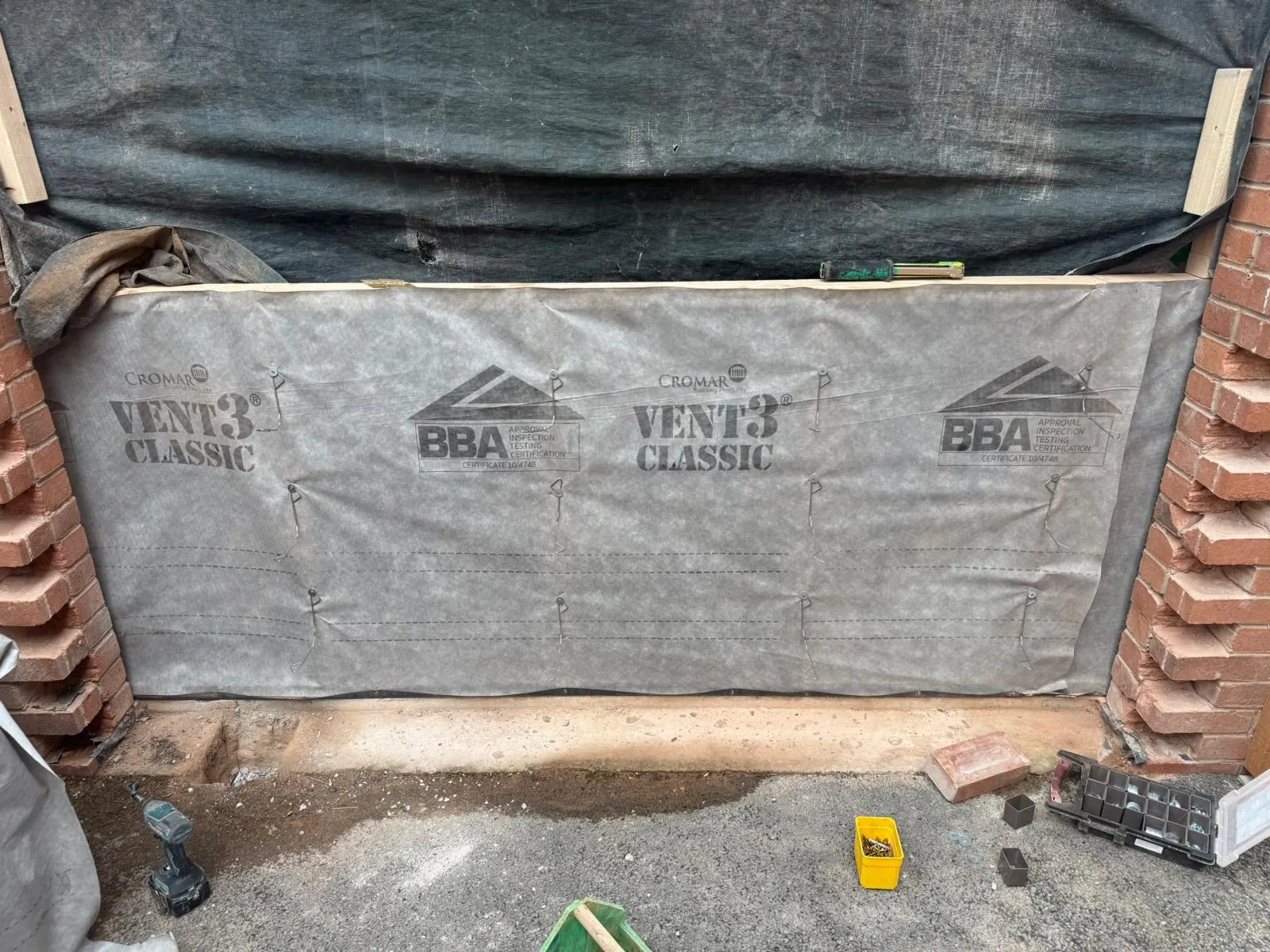 Breather membrane fixed across the new infill wall where the garage door was removed