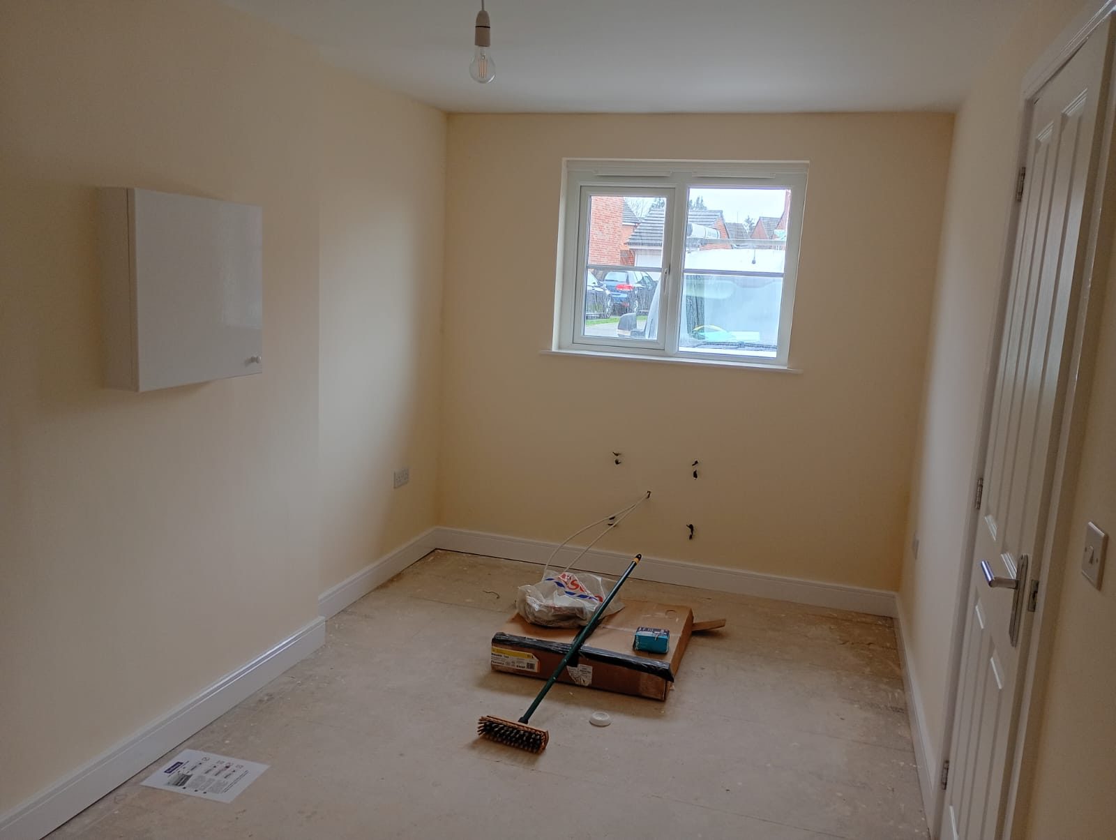 Newly finished room with plastered walls, new skirting and a new window, ready for flooring