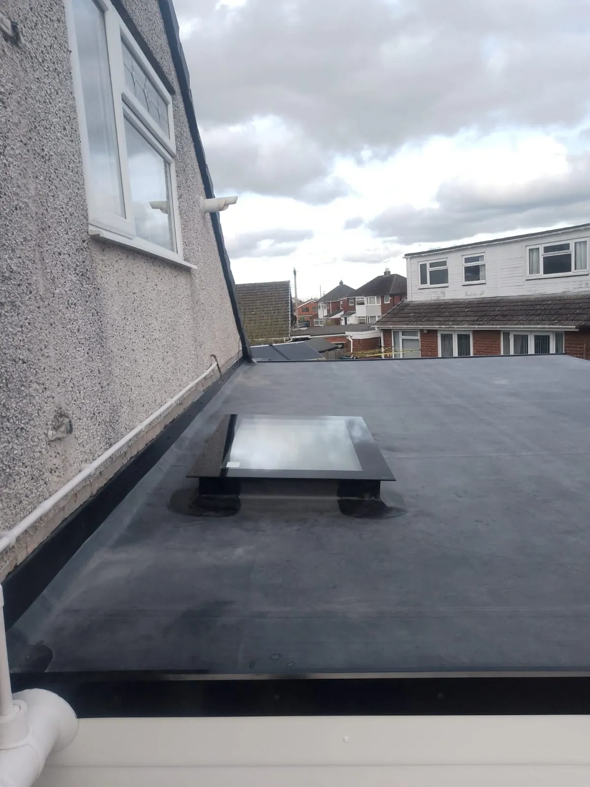 New flat roof with a rooflight on a garage conversion