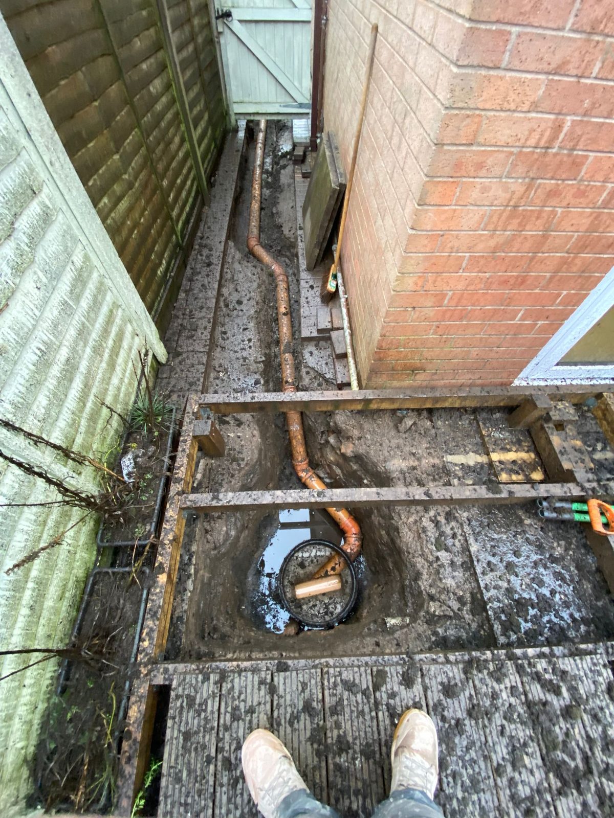 New drain run laid down a side passage to a new inspection chamber