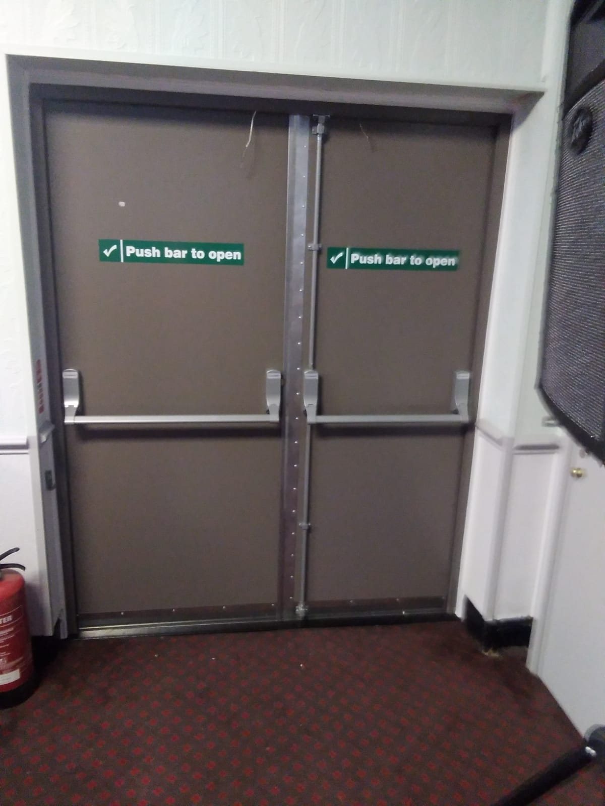Pair of fire exit doors with new push bars fitted, marked push bar to open