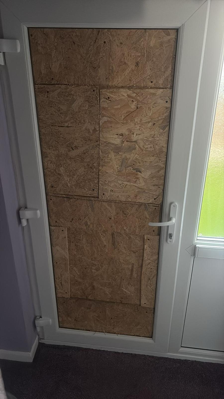Glazed door fully boarded in OSB from the inside
