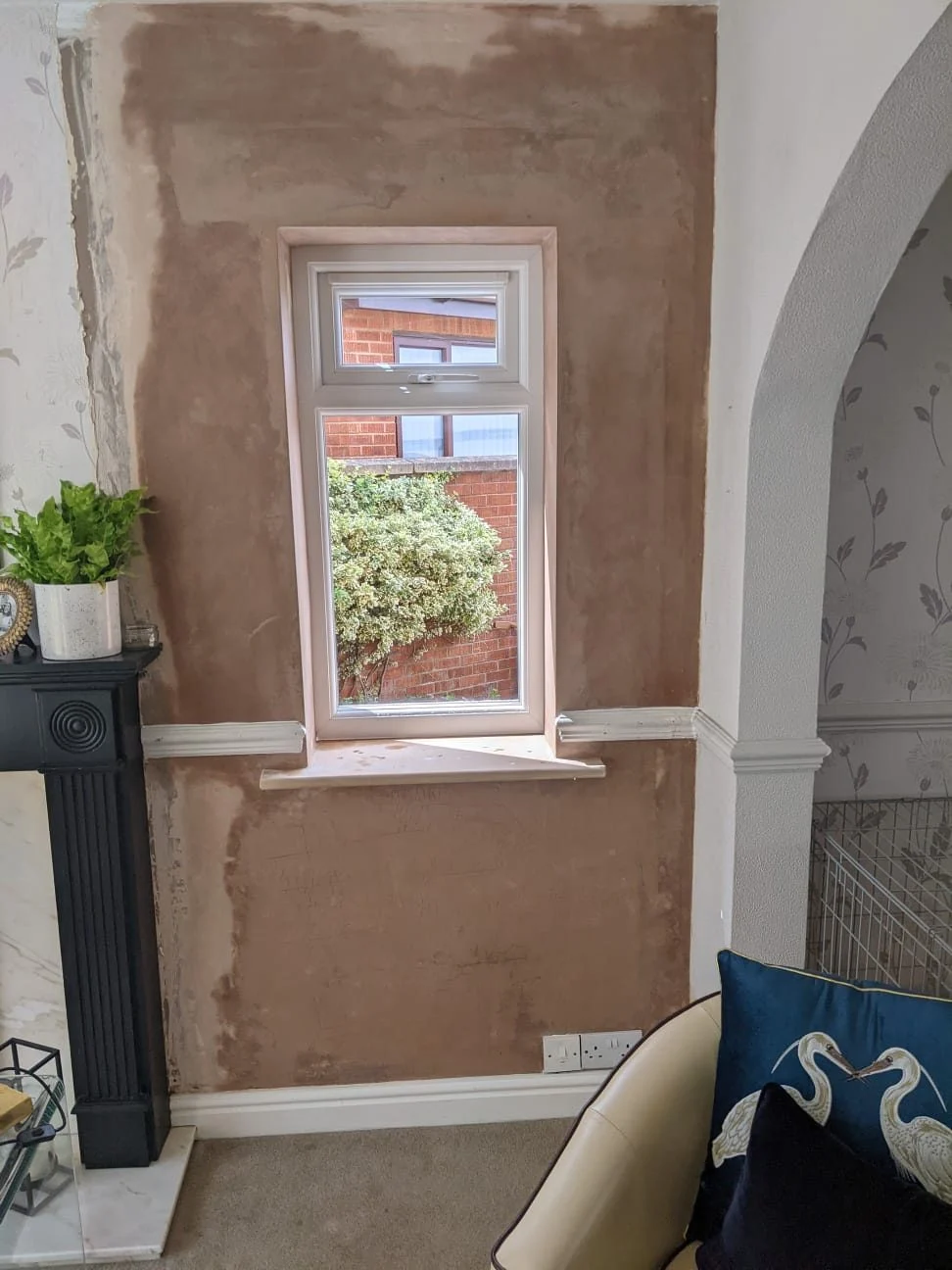 Freshly plastered reveal and wall around a replacement window, made good ready for decoration by Quirks Property Maintenance