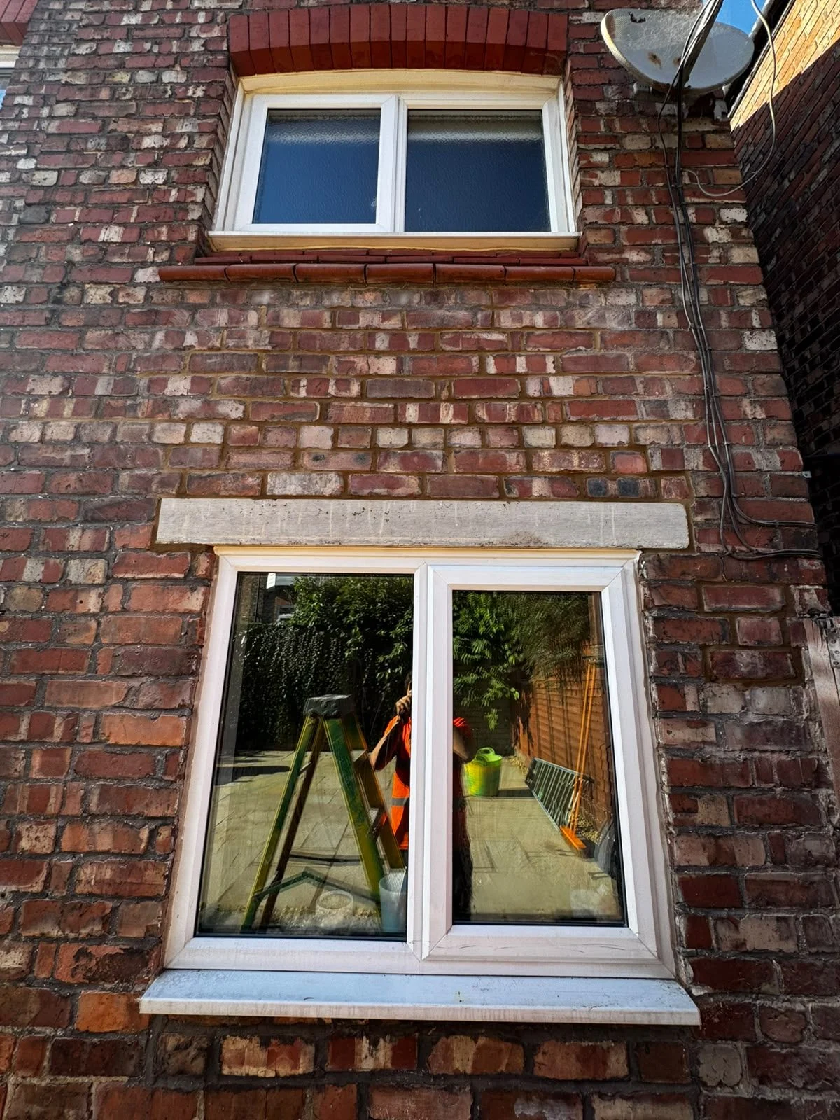 New concrete lintel over a rear window of an end-of-terrace house in Wallasey
