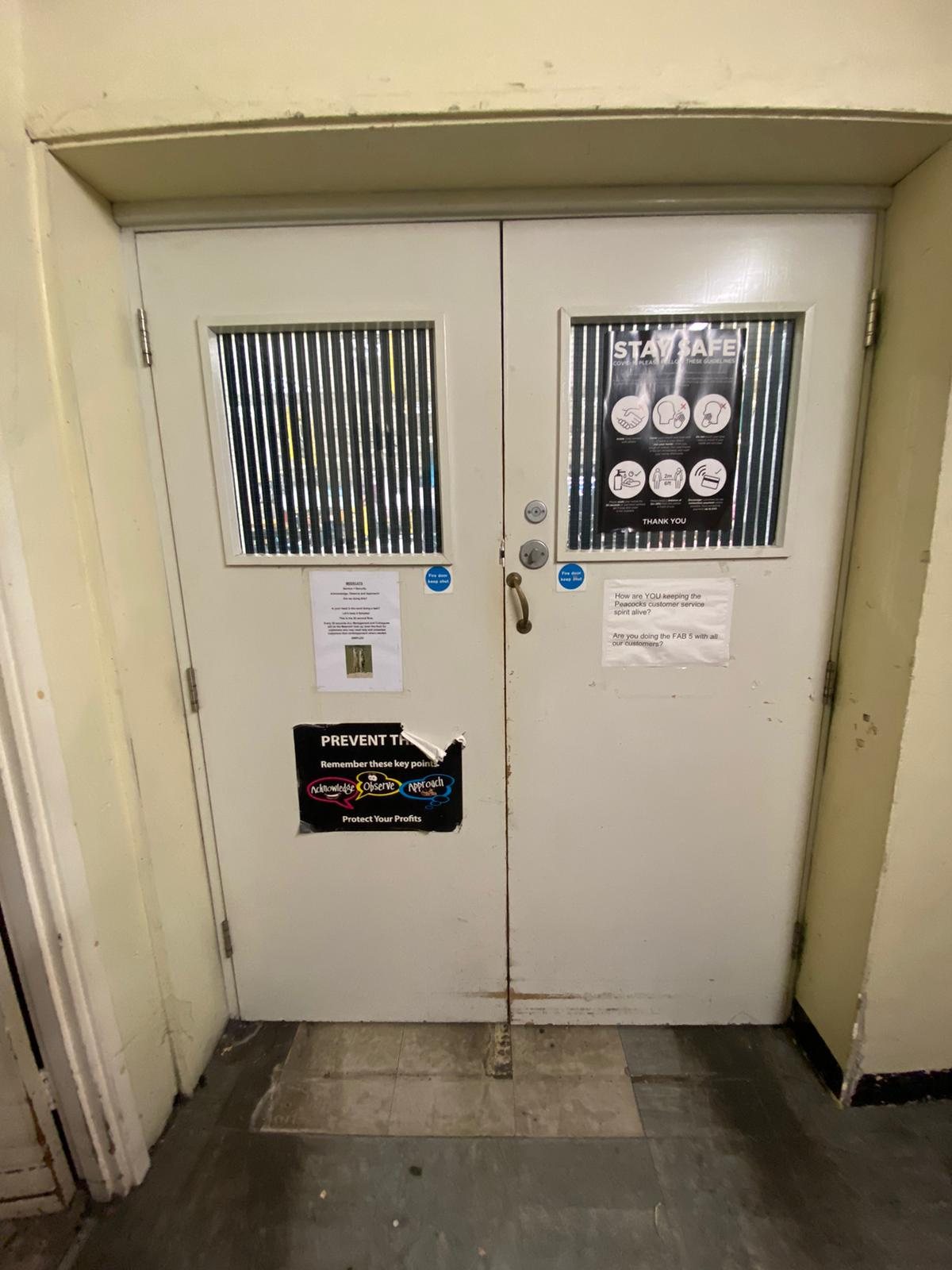 Pair of doors with vision panels and deadbolts fitted to the leading edges