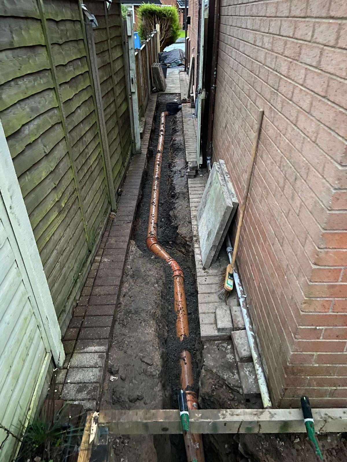 New drain run laid along the length of a trench