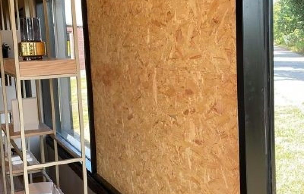 Broken glass on the floor inside a forced door before securing